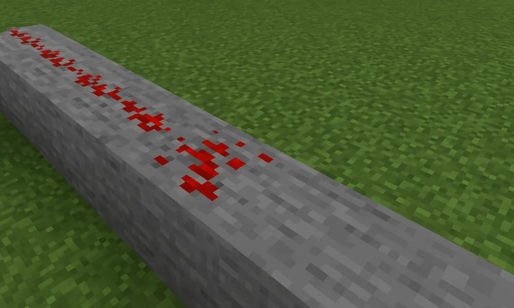 What is the maximum redstone line length from a power source without a repeater?